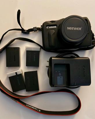 Canon EOS-M (ML) + Neewer 35mm f1.7 + 4 Batterie