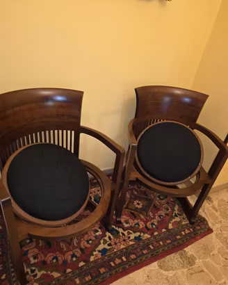Coppia di poltrone Cassina modello "Barrel Chair".