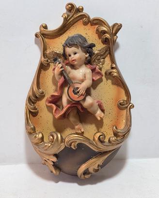 Acquasantiera in resina raffigurante putto 