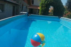 Ampia Bifamiliare con Giardino di 2000 m² e Grandi