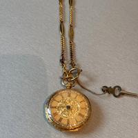 Orologio taschino in ORO 18K finemente cesellato