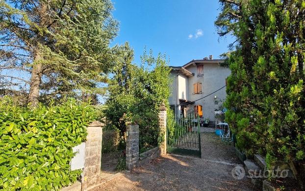 Appartamento con giardino e terreno