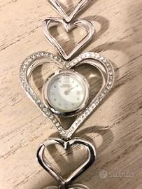 Orologio bracciale in acciaio e zirconi.