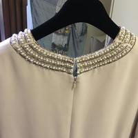 Abito tubino color crema con ricamo