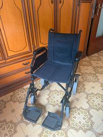 Sedia a rotelle pieghevole Surace