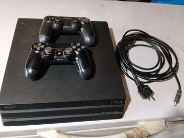 PS4 pro 1 TB con due pad e giochi