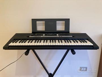 Pianola con custodia e piedistallo