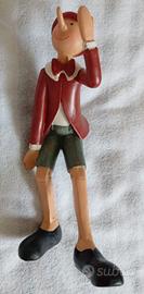 Pinocchio in resina con mano alzata
