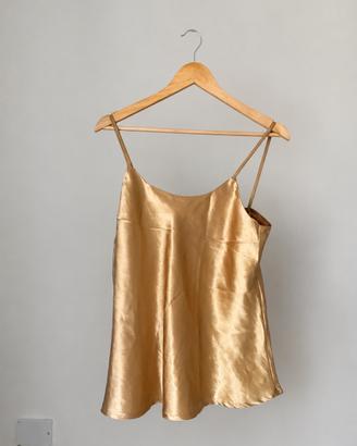 Top in color oro