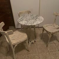 Tavolino tondo in marmo con stelo in ghisa