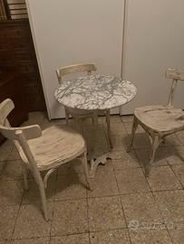 Tavolino tondo in marmo con stelo in ghisa