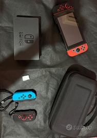 Nintendo switch + Mario kart Deluxe 8 + 4 joystick