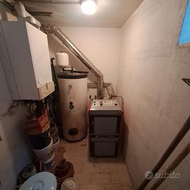 Caldaia a legna Atmos Nordica a fiamma inversa