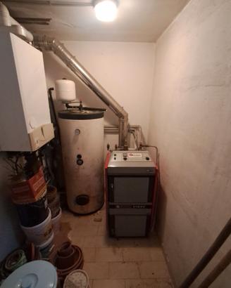 Caldaia a legna Atmos Nordica a fiamma inversa
