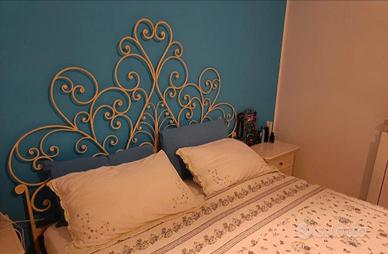Testata letto in ferro battuto con rete