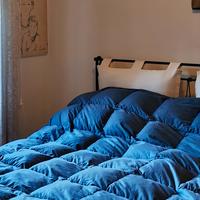 letto contenitore con testata in ferro battuto 