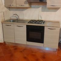 mobili cucina e camera da letto e lavatrice