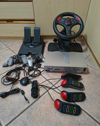 PlayStation 2 Silver+ 2 joystick+ volante+ buzz