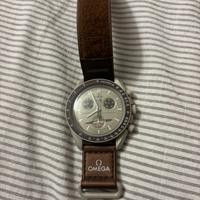 Swatch Omega Saturno