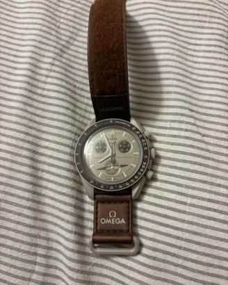 Swatch Omega Saturno
