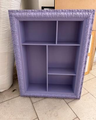 Pezzo d’arredo portoggetti con cornice