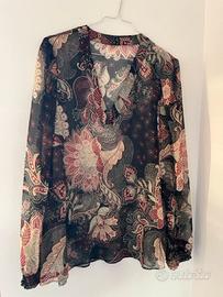 Blusa trasparente a maniche lunghe