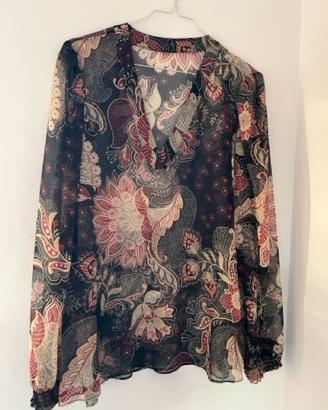 Blusa trasparente a maniche lunghe