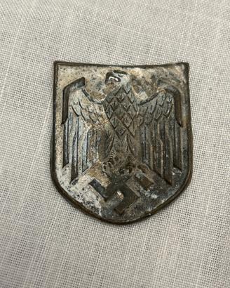 Scudetto metallico per elmetto II WW