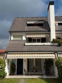 Villetta a schiera con giardino e garage