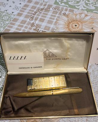 Penna e accendino placcati oro