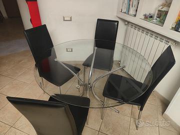 Tavolo rotondo piano in vetro