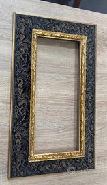 Cornice lavorata oro nera.