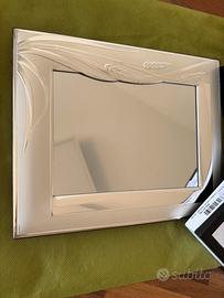 Cornice-specchio in argento