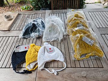 Stock di 18 berretti, pura lana per bambini REIMA