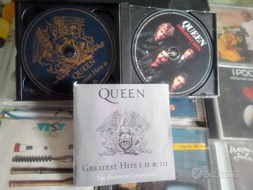 Dischi CD con lettore cd e contenitori di cd,,