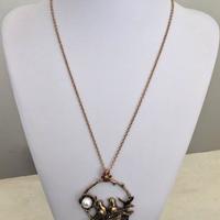 Collana in ottone con medaglione usignoli