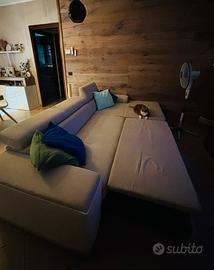 Divano letto con penisola contenitrice