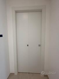 Porta pirghevole a libro con telaio