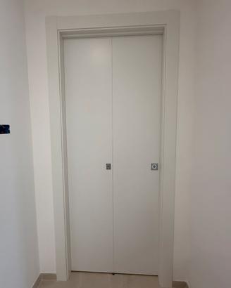 Porta pirghevole a libro con telaio