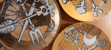 Piatti Fornasetti dorati vintage