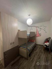 Letto a castello con armadio integrato