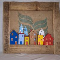 Quadro in legno vecchio con casette colorate
