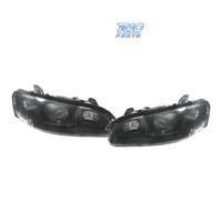 FARI PER OPEL OMEGA 94-99 LENTE A LENTE NERA