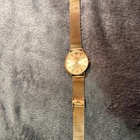 Orologio Meridien dorato con cinturino mesh