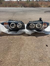 COPPIA FARI ANTERIORI BMW SERIE 1  CON ANGEL EYES