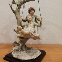 Capodimonte bambini in altalena