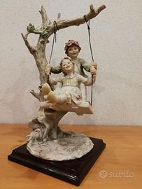 Capodimonte bambini in altalena