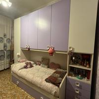 Letto a ponte con armadio e cassetti