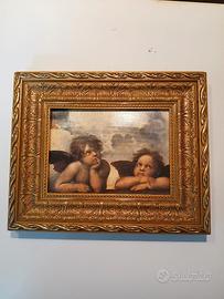 Quadro con cornice dorata 