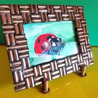 cornice artigianale in ottone